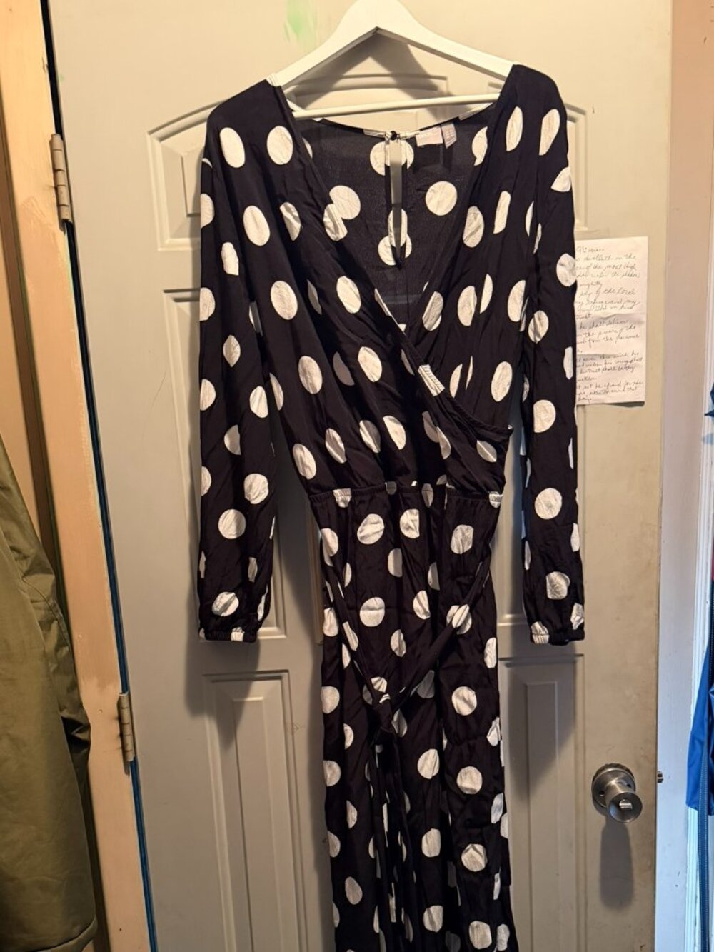 ASOS Design wrap tie jumpsuit features a bold mono polka dot pattern (18W)